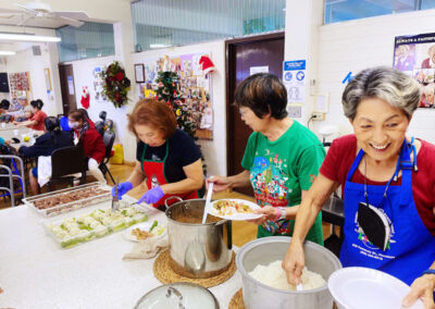 Makiki-christian-church-seniors-smile-serving-food-plate-rice-lunch